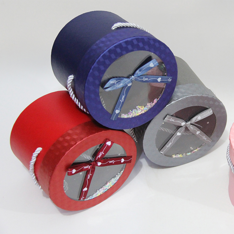 صندوق هدايا حلوى دائري شفاف 80101 مزين بقوس شريطي